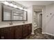 Large bathroom featuring double sinks, dark wood cabinets, and modern finishes at 548 Gosford Ct, Westfield, IN 46074