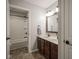 Well-lit bathroom with double sink vanity, tub, and modern fixtures at 548 Gosford Ct, Westfield, IN 46074