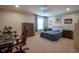 Spacious bedroom with a bed, carpet, a ceiling fan, and decor at 548 Gosford Ct, Westfield, IN 46074