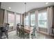 Bright dining area featuring large windows, a chandelier, and seating for six at 548 Gosford Ct, Westfield, IN 46074