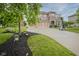 Charming two-story home with a well-manicured front yard and three-car garage at 548 Gosford Ct, Westfield, IN 46074