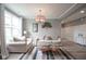 Cozy living room featuring wood floors, neutral decor, and seamless access to the entry area at 548 Gosford Ct, Westfield, IN 46074