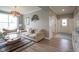 Warm living room showcasing wood floors, a neutral color scheme, and access to the entry foyer at 548 Gosford Ct, Westfield, IN 46074