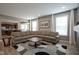 Open-concept living room featuring wood floors, neutral colors, and seamless access to the kitchen at 548 Gosford Ct, Westfield, IN 46074