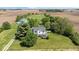Aerial shot of a white house with a large yard, surrounded by farmland at 5480 E County Rd 800 N, Brownsburg, IN 46112