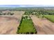 Aerial view of a farm with home, barn, and green grass surrounded by farmland at 5480 E County Rd 800 N, Brownsburg, IN 46112