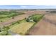 An aerial view of a property including a home and barn with farmland at 5480 E County Rd 800 N, Brownsburg, IN 46112