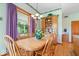 Dining room featuring hardwood floors, a large window, and a built-in china cabinet at 5480 E County Rd 800 N, Brownsburg, IN 46112