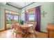 Dining room featuring hardwood floors, large windows, and french doors to outdoor space at 5480 E County Rd 800 N, Brownsburg, IN 46112