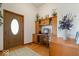 Bright foyer with hardwood floors, a decorative door, and a built-in desk and shelving at 5480 E County Rd 800 N, Brownsburg, IN 46112