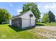 Two-car garage with basketball hoop next to a grassy lawn on a sunny day at 5480 E County Rd 800 N, Brownsburg, IN 46112