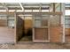Close-up of a well-maintained wooden horse stall, featuring a metal grate at 5480 E County Rd 800 N, Brownsburg, IN 46112