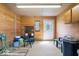 Interior with wood paneling, fluorescent lighting, chairs, and storage containers at 5480 E County Rd 800 N, Brownsburg, IN 46112