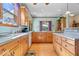 Bright eat-in kitchen with wooden cabinets, hardwood floors, and plentiful natural light at 5480 E County Rd 800 N, Brownsburg, IN 46112