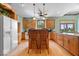 Spacious kitchen features wood floors, a kitchen island, and ample counter space at 5480 E County Rd 800 N, Brownsburg, IN 46112