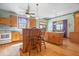Open kitchen with wood floors, island seating, and abundant natural light at 5480 E County Rd 800 N, Brownsburg, IN 46112