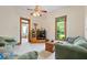 Comfortable living room featuring a mounted TV, hardwood trim, and plush seating at 5480 E County Rd 800 N, Brownsburg, IN 46112