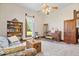 Cozy living room with a piano, bookshelf, and lots of natural light at 5480 E County Rd 800 N, Brownsburg, IN 46112