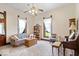 A cozy living room with a piano, comfortable seating, and lots of natural light at 5480 E County Rd 800 N, Brownsburg, IN 46112