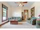 Bright living room featuring comfortable seating, carpet, and a large window at 5480 E County Rd 800 N, Brownsburg, IN 46112