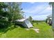 Exterior shot of a small shed with an unkempt lawn, next to the house at 5480 E County Rd 800 N, Brownsburg, IN 46112