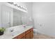 Bright bathroom with a double sink vanity, framed mirror, and a separate shower and toilet area at 5503 Wilder Way, Indianapolis, IN 46216