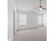 Spacious bedroom with vaulted ceiling, neutral paint and carpet, and natural light from the two windows at 5503 Wilder Way, Indianapolis, IN 46216