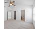 This empty bedroom offers neutral tones, vaulted ceilings, and access to an en suite bathroom and walk-in closet at 5503 Wilder Way, Indianapolis, IN 46216