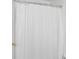 Neutral bathroom shower featuring a white shower curtain and silver hardware at 5503 Wilder Way, Indianapolis, IN 46216