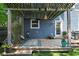 Cozy back deck featuring a charming pergola, comfortable seating, and beautiful potted flowers at 609 E 39Th St, Indianapolis, IN 46205