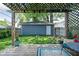 Inviting backyard featuring a charming pergola-covered deck and a lush lawn, perfect for outdoor relaxation at 609 E 39Th St, Indianapolis, IN 46205