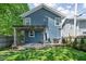 Spacious backyard featuring a wooden deck with a pergola, a grill, and a well-maintained lawn at 609 E 39Th St, Indianapolis, IN 46205