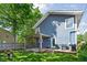Backyard with a pergola covered deck with a grill, a lush lawn, and mature trees at 609 E 39Th St, Indianapolis, IN 46205