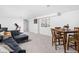 Spacious finished basement with a comfortable seating area and dining set, ideal for entertaining at 609 E 39Th St, Indianapolis, IN 46205