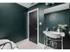 Stylish bathroom with a vintage sink, black and white tile floor, and decorative mirror at 609 E 39Th St, Indianapolis, IN 46205
