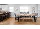 Bright dining area includes wooden table, accent seating, large windows, and kitchen access at 609 E 39Th St, Indianapolis, IN 46205