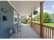 Charming front porch with cozy seating, perfect for enjoying the neighborhood views at 609 E 39Th St, Indianapolis, IN 46205