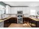 Modern kitchen features stainless steel appliances, wood countertops, tile backsplash and ample storage at 609 E 39Th St, Indianapolis, IN 46205