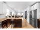 Bright kitchen with stainless steel appliances, hardwood floors, wood counters, and dining area at 609 E 39Th St, Indianapolis, IN 46205