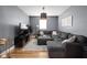 A cozy living room features a large sectional sofa, neutral colors and warm lighting at 609 E 39Th St, Indianapolis, IN 46205