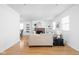 Bright and airy living room boasts a classic fireplace, light hardwood floors and natural light at 609 E 39Th St, Indianapolis, IN 46205