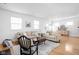 Spacious living room with hardwood floors, comfortable sofas, and neutral decor at 609 E 39Th St, Indianapolis, IN 46205