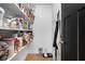 Bright pantry features wood floors, open shelving and a black door at 609 E 39Th St, Indianapolis, IN 46205