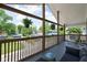 Relaxing covered patio with outdoor seating and hanging plants overlooking neighborhood at 609 E 39Th St, Indianapolis, IN 46205