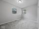 This bedroom offers neutral walls and soft carpet providing a blank slate for personalization and rest at 618 Miller Ave, Shelbyville, IN 46176