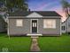 Charming single-story home featuring a well-manicured lawn and inviting entrance at 618 Miller Ave, Shelbyville, IN 46176
