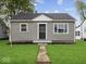 Well-maintained single-story home with a tidy front lawn and classic facade at 618 Miller Ave, Shelbyville, IN 46176