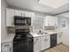 Well-equipped kitchen with modern appliances, ample cabinetry, and tile backsplash at 618 Miller Ave, Shelbyville, IN 46176