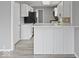 Bright kitchen with white cabinetry, stainless steel appliances, and a spacious layout at 618 Miller Ave, Shelbyville, IN 46176