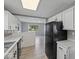 Spacious kitchen showcasing modern appliances and an open connection to the living room at 618 Miller Ave, Shelbyville, IN 46176